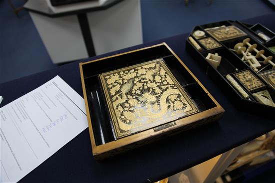 A Chinese export gilt decorated black lacquer sewing box, containing ivory accessories, mid 19th century, 39cm.